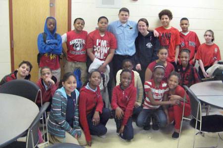 Mildred Ave. kids: Firefighter Jim Walsh joined students from the Mildred Avenue School on Monday. Shown, (standing, l-r) are Yanell Woods, Camari Bailey, Jaquan Jones, Firefighter Jim Walsh, teacher Lynne Travers, Jamoni Waller, Narzvel Sawyer Rodriguez and Evy Ayala; (sitting, l-r) Ibsael Polanco, Danny Silvestre, Simone Darling, Chiosna Bernadeau, Tyra Jennings,Kendra Cole, Destiny Omo, Princess Sawyer Rodriguez, Keren Osorio and Tamera Francois.